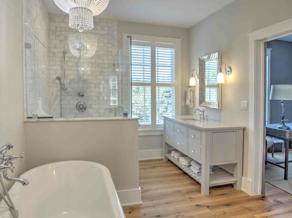 A bathroom with a tub and a shower