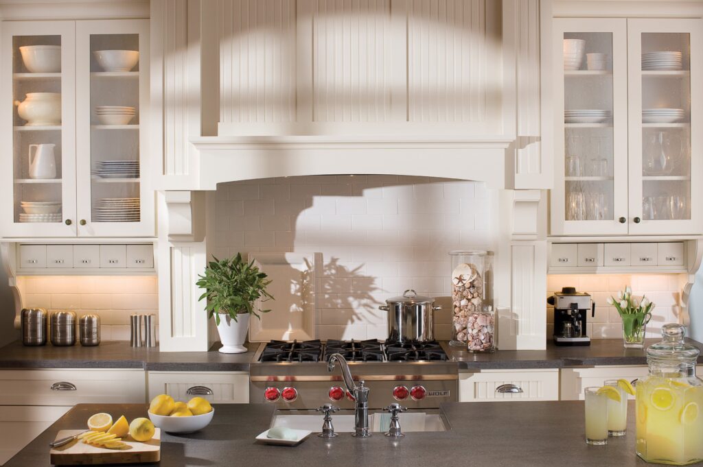 A custom white kitchen hood.