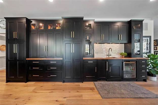 A large black custom wet bar.