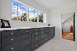 Black built-in drawers in a closet by Laslo Custom Kicthens.
