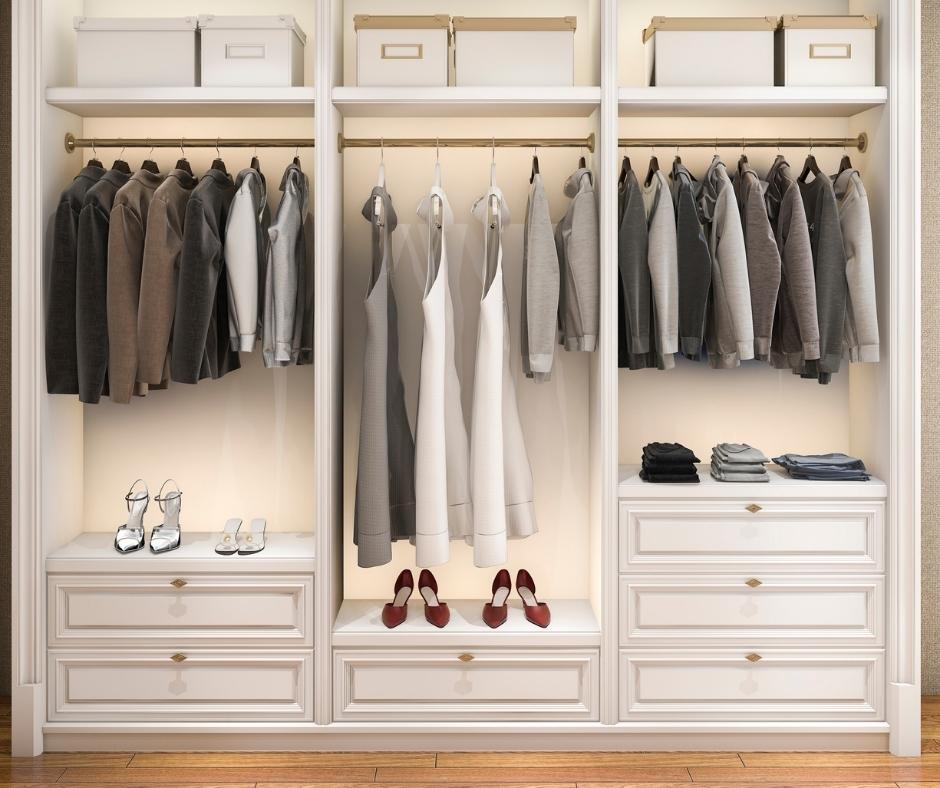 White closet with built-in drawers.