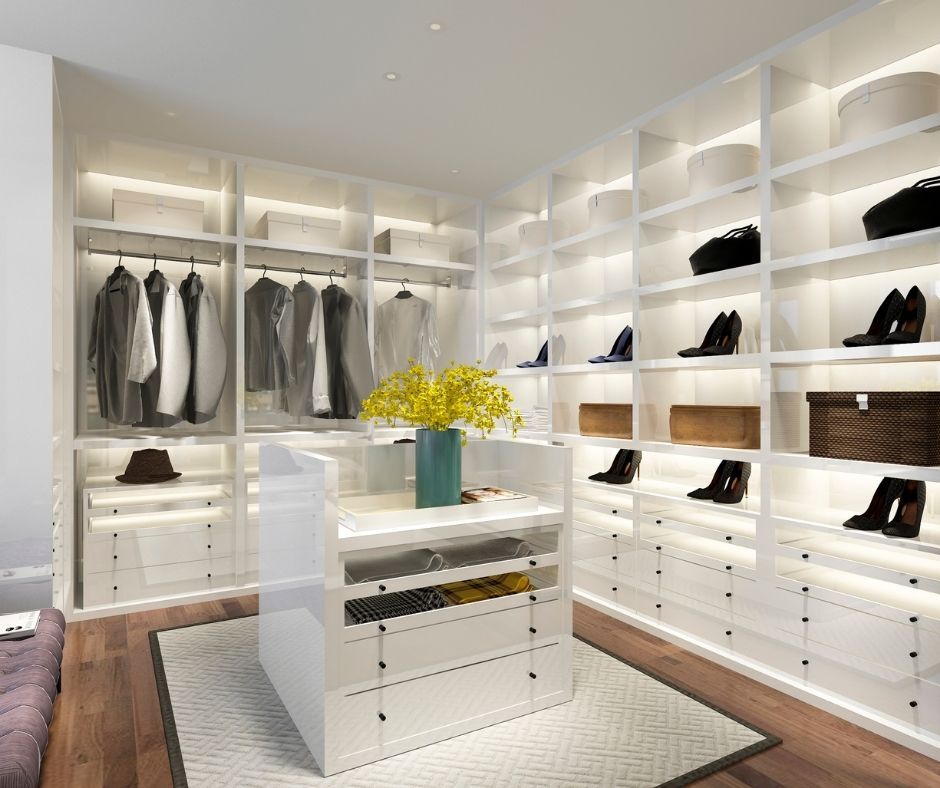 Walk-in closet with shite shelves.