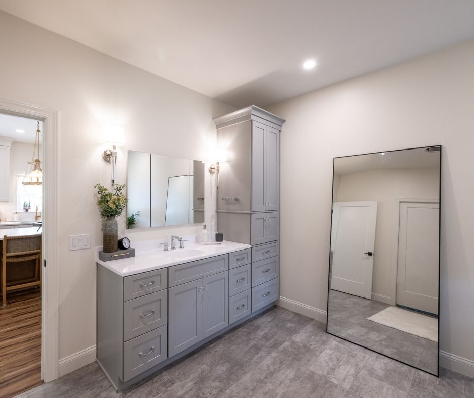 A kitchen with gray cabinets.
