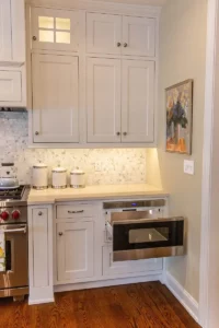 microwave drawer in a kitchen remodel with white cabinets