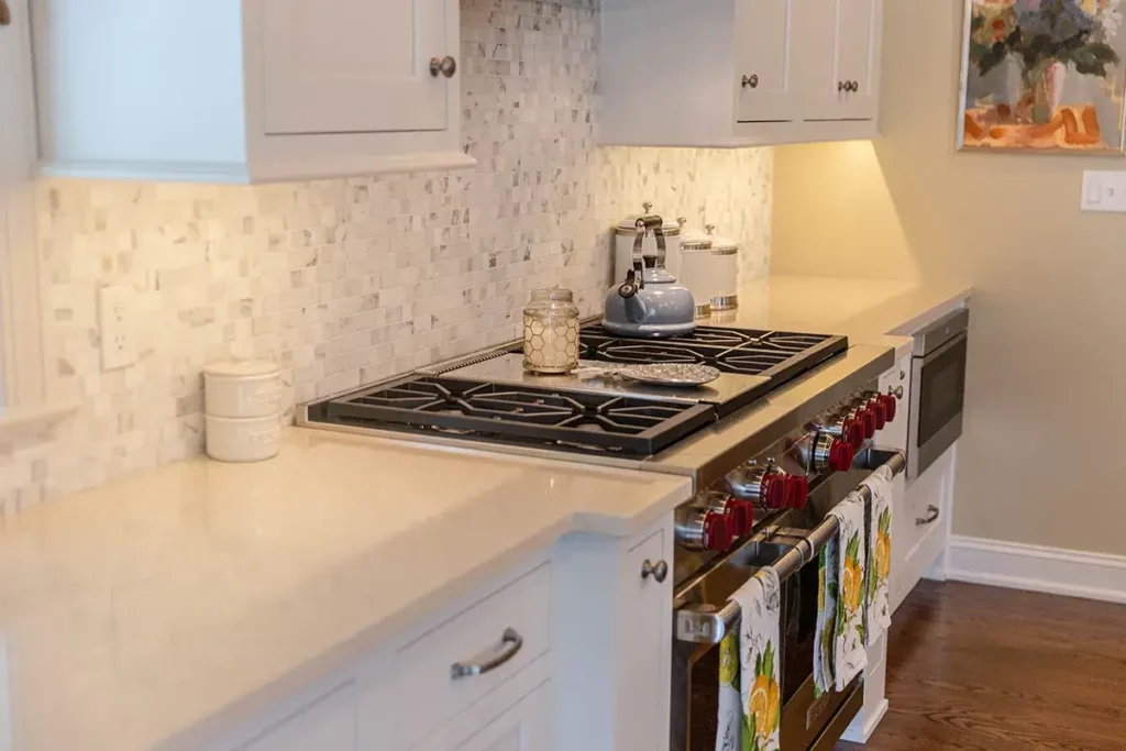 white kitchen countertop with a wolf range