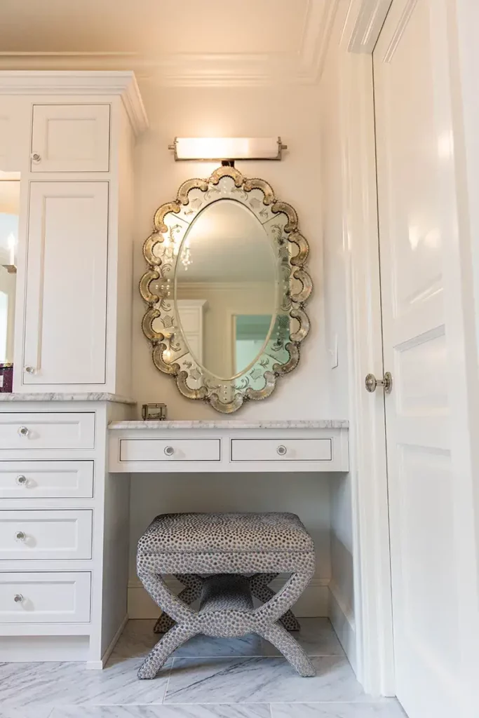 Custom white makeup sitting area in custom bathroom remodel
