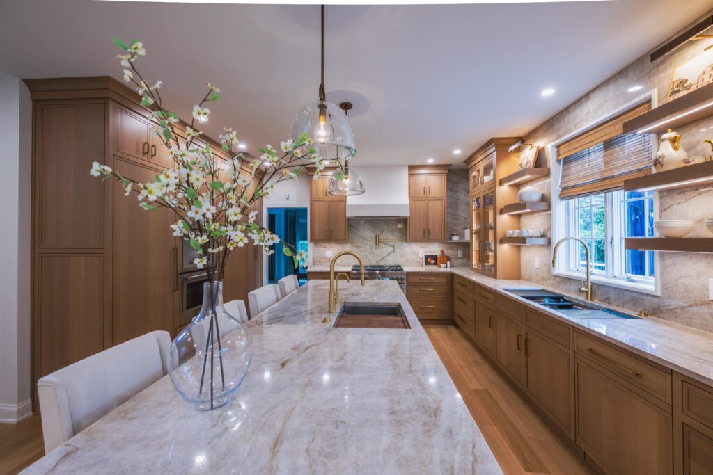 A kosher kitchen with large island and oak cabinetry.