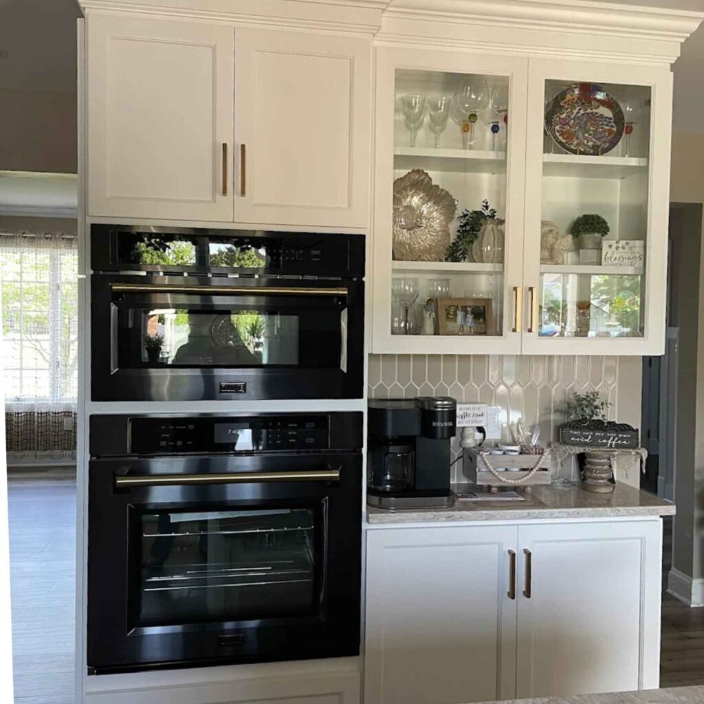 Black wall appliances and white cabinets in an Easton kitchen remodel.
