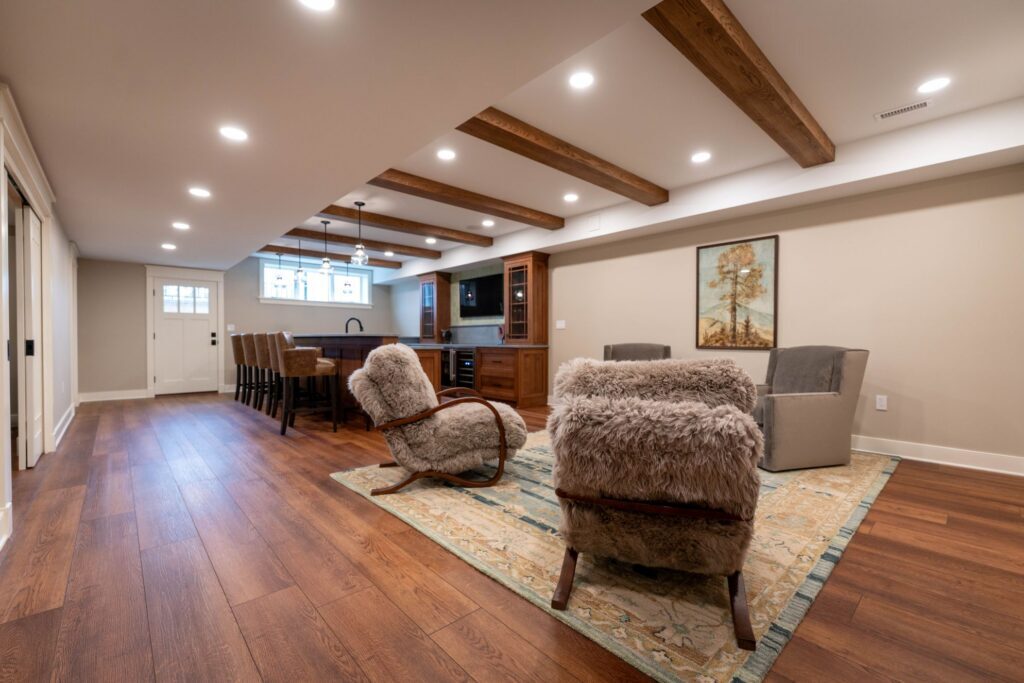a coopersburg basement bar with beamed ceilings and fur chairs