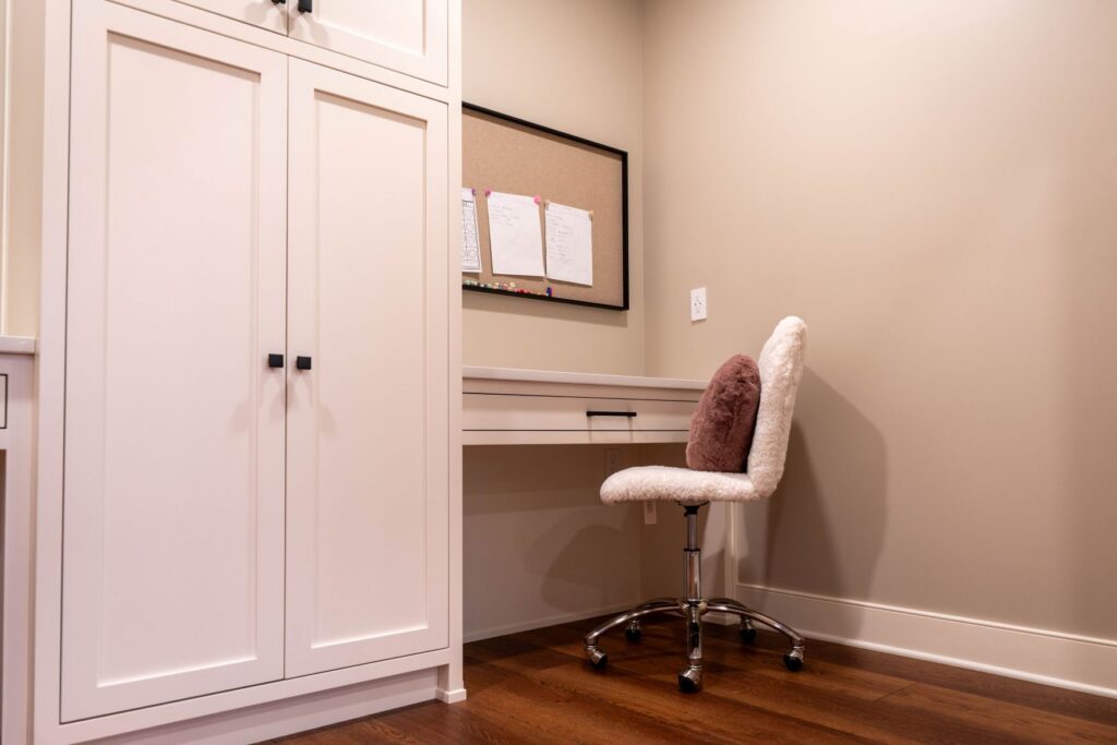 Homework nook with painted maple cabinets and quartz desk top by Laslo Custom Kitchens