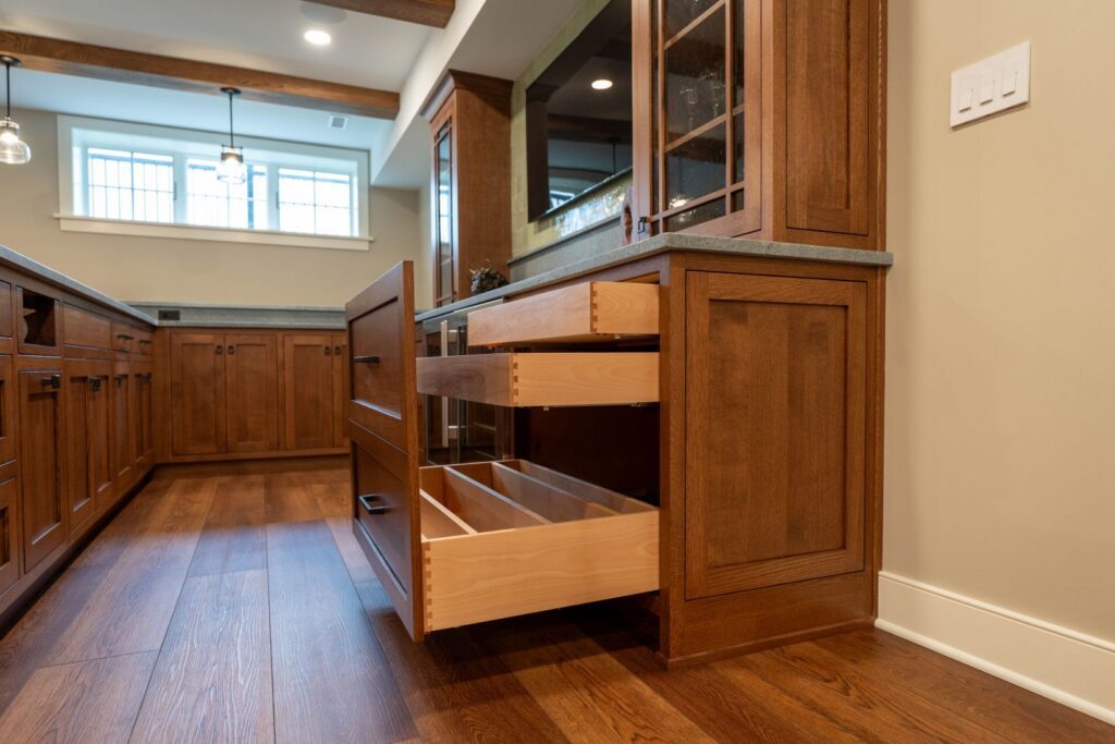 Flush inset cabinet drawers with dovetail construction and extra depth for storing large items