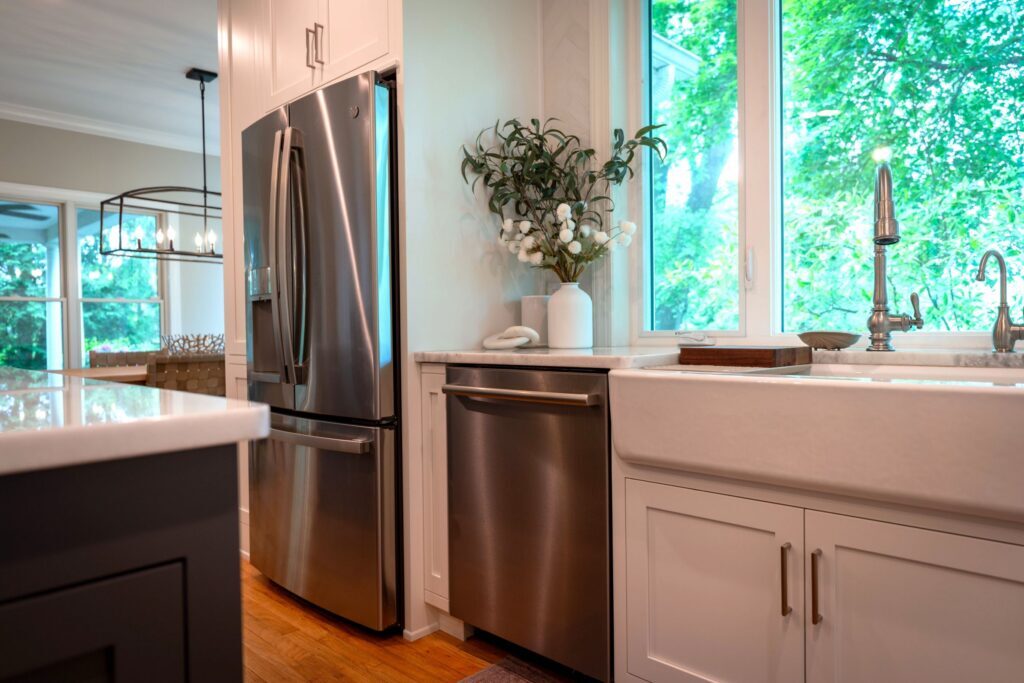 GE appliances in stainless steel next to a porcelain farmhouse sink in center valley pa