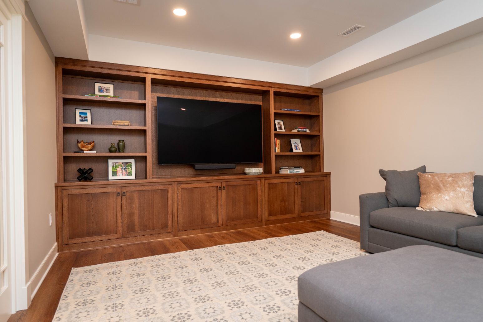 Built in entertainment wall with custom cabinets and shelving