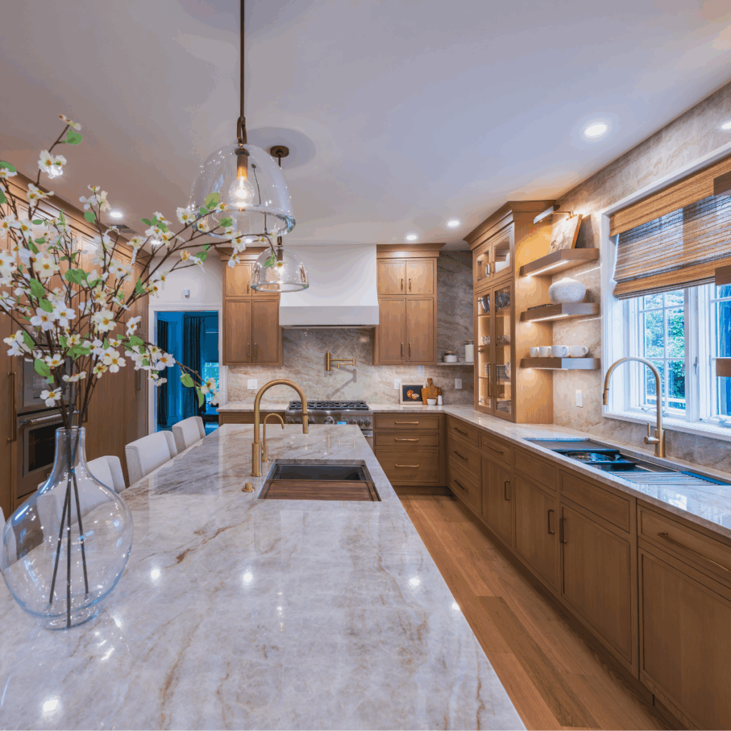 A large kitchen with light brown cabinets and large island.