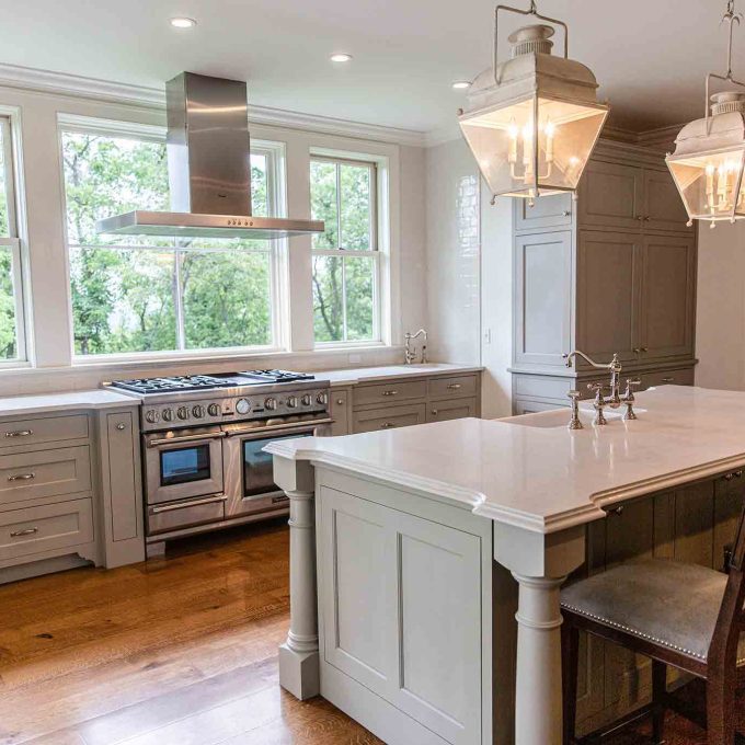A kitchen with a large island and a stove