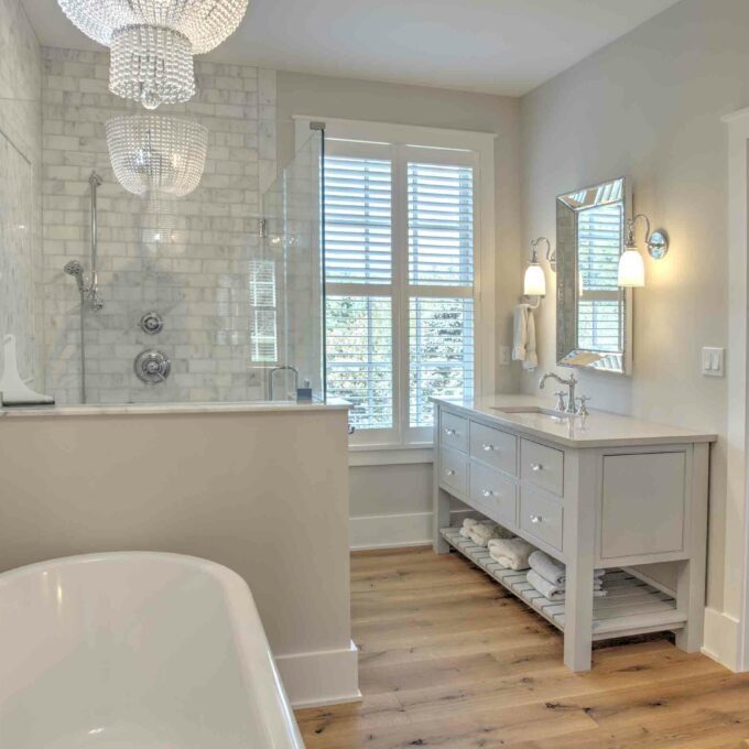 A bathroom with a tub and a shower