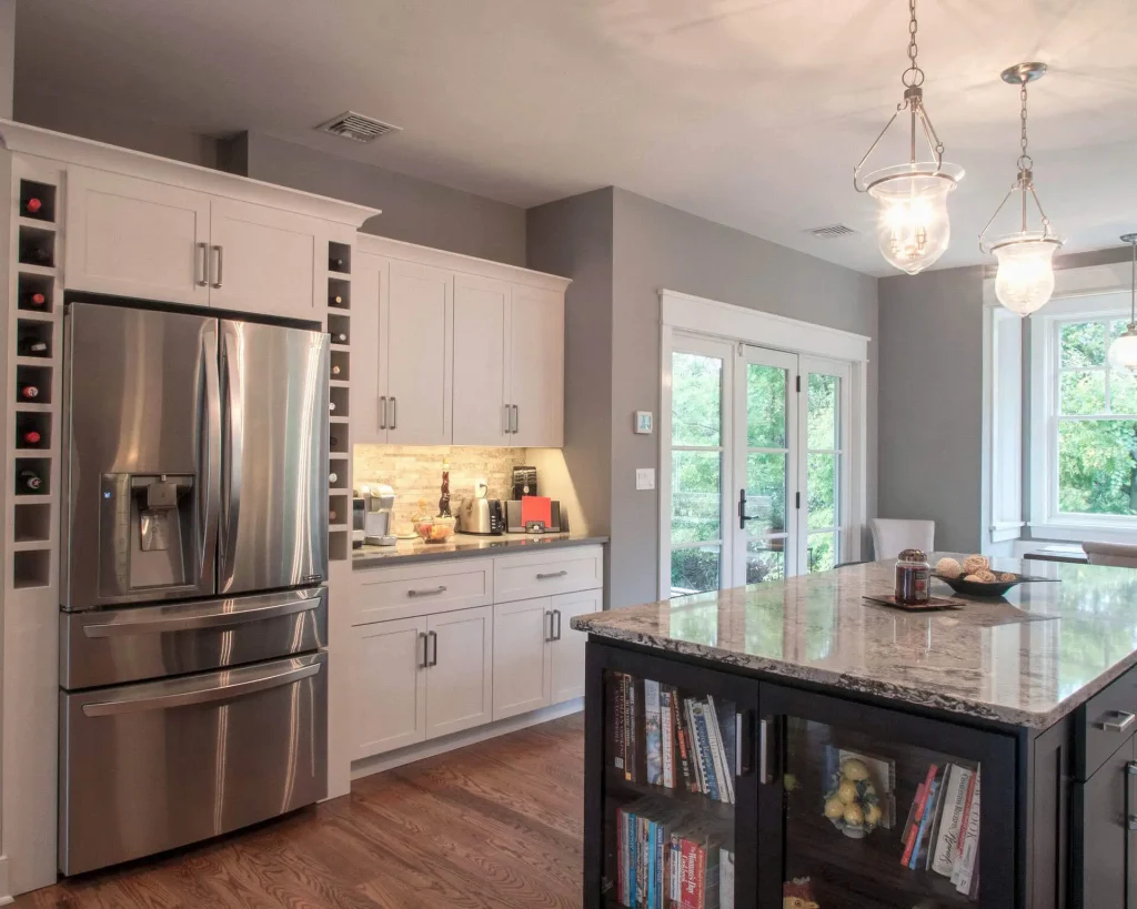 A kitchen with a marble island