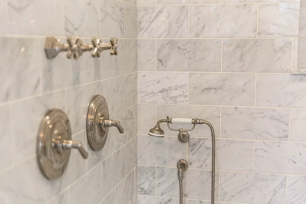 marble tile bathroom with nickle plated shower fixtures