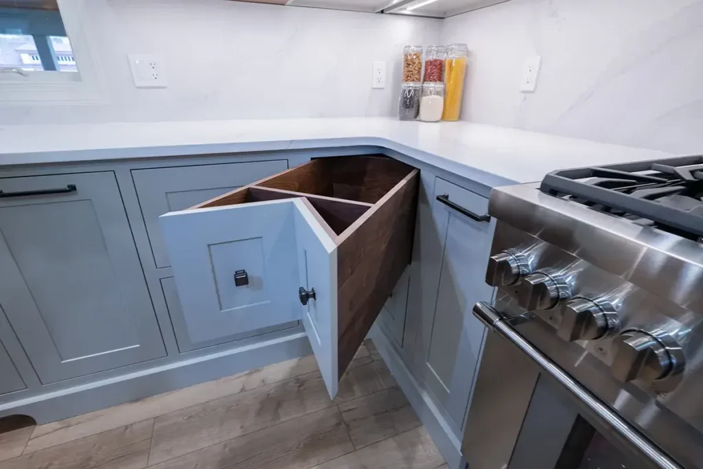custom cabinetry organization solutions using a custom built corner drawer to maximize space and functionality