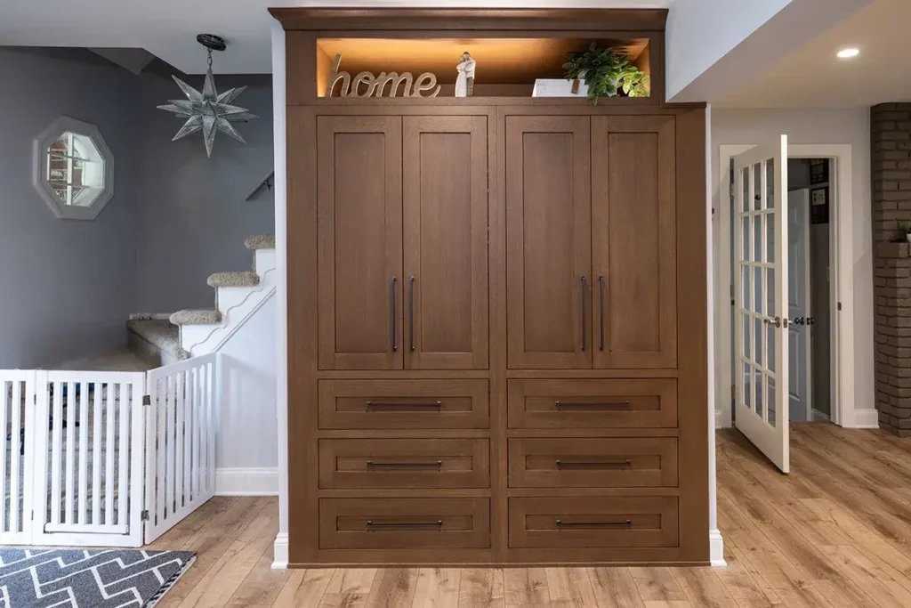 A custom entry way cabinet that incorporates lighting and added storage