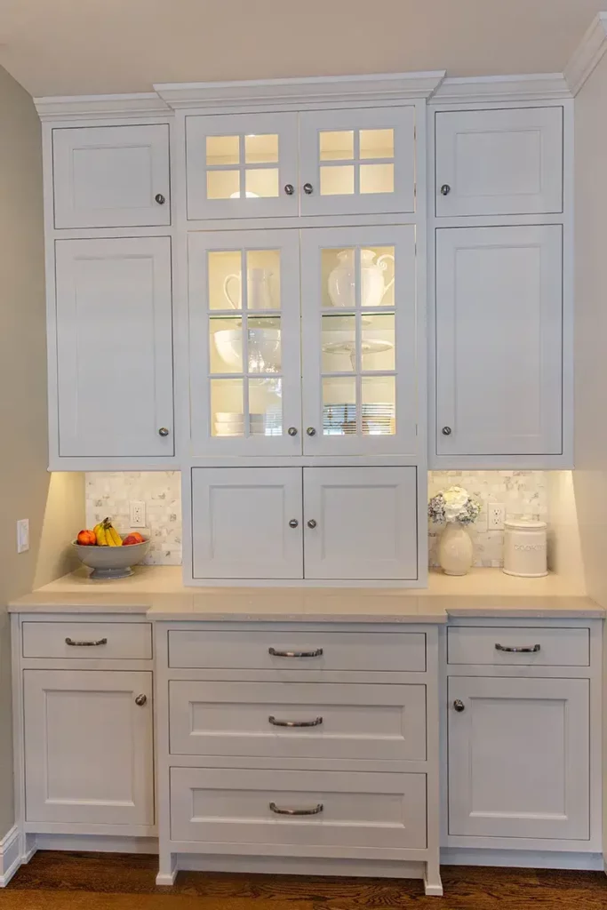 Custom white kitchen cabinetry dinnerware organization