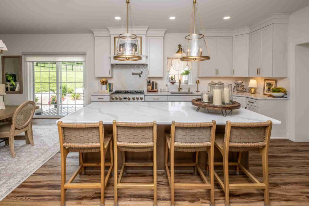 This Laslo kitchen remodel features a large island with 4 woven barstools.