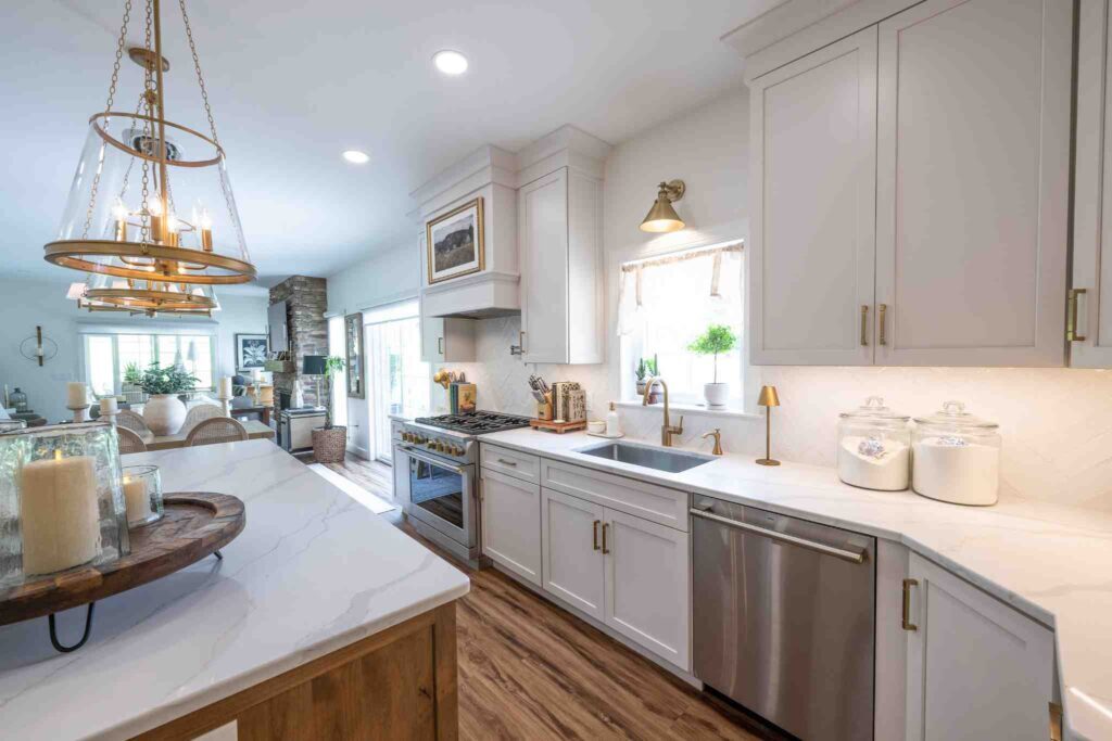 A kitchen with white cabinets and an island with sesame stain.