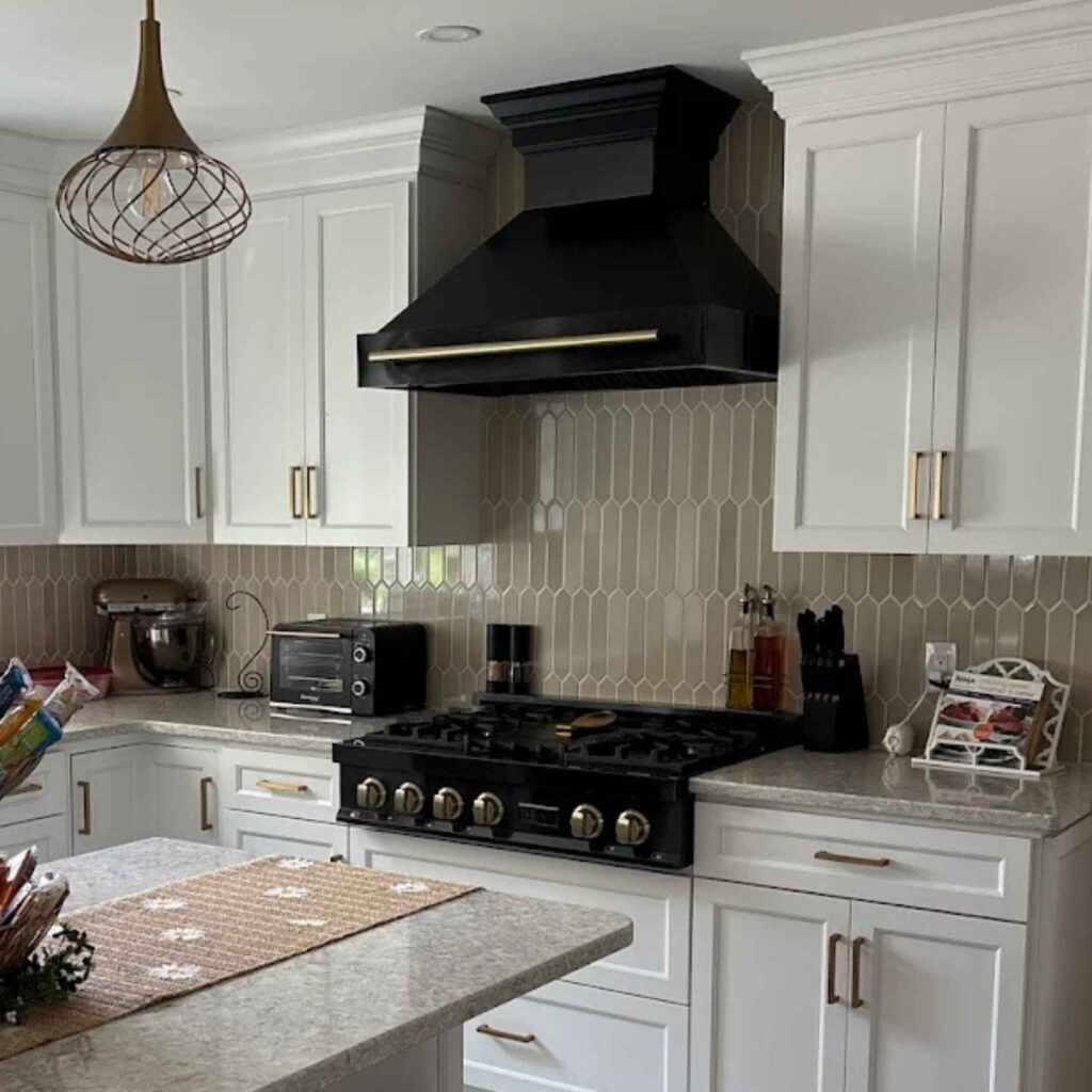 A black range and white cabinets in Easton kitchen.