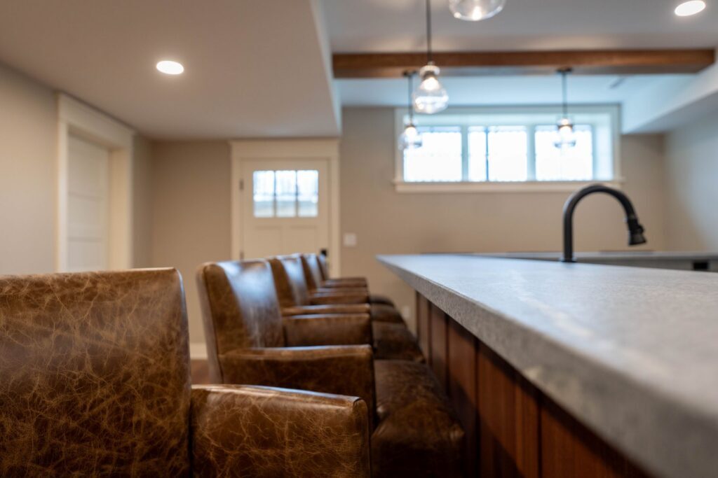 leather bar stools flanking a soapstone countertop