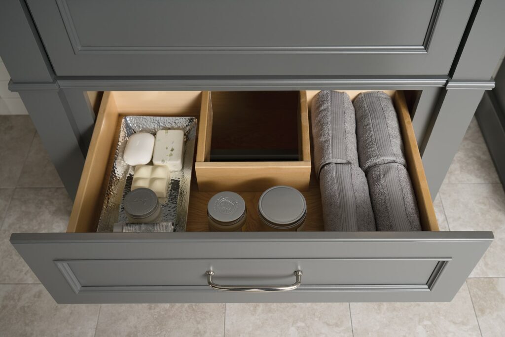 under sink storage designed to go around plumbing. open door picture