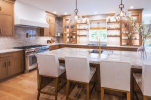 Three chairs in a kitchen with open shelves