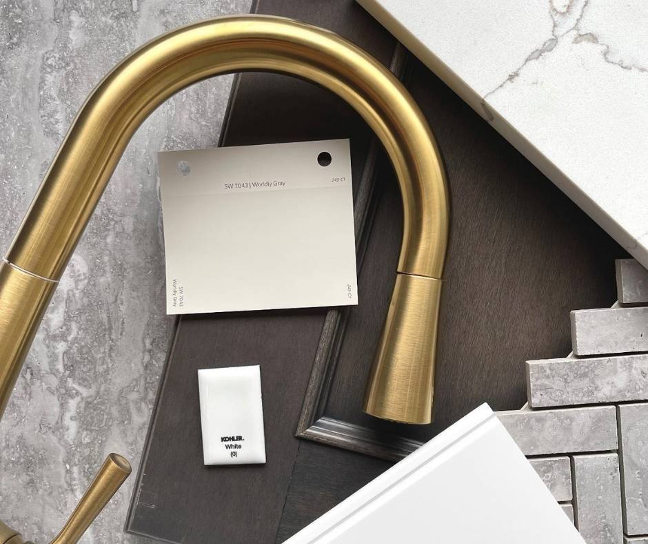 Product samples for a gold faucet, tiles, countertop and wood cabinet door.