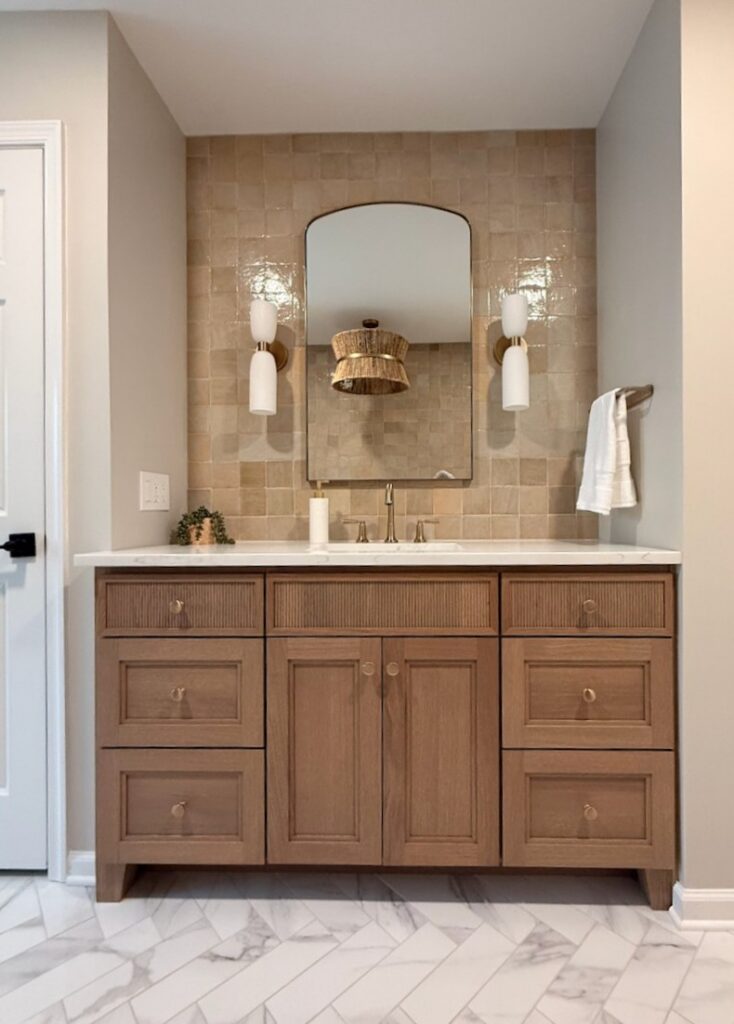 rift cut oak reeded vanity with herringbone marble floor and hand made backsplash tiles