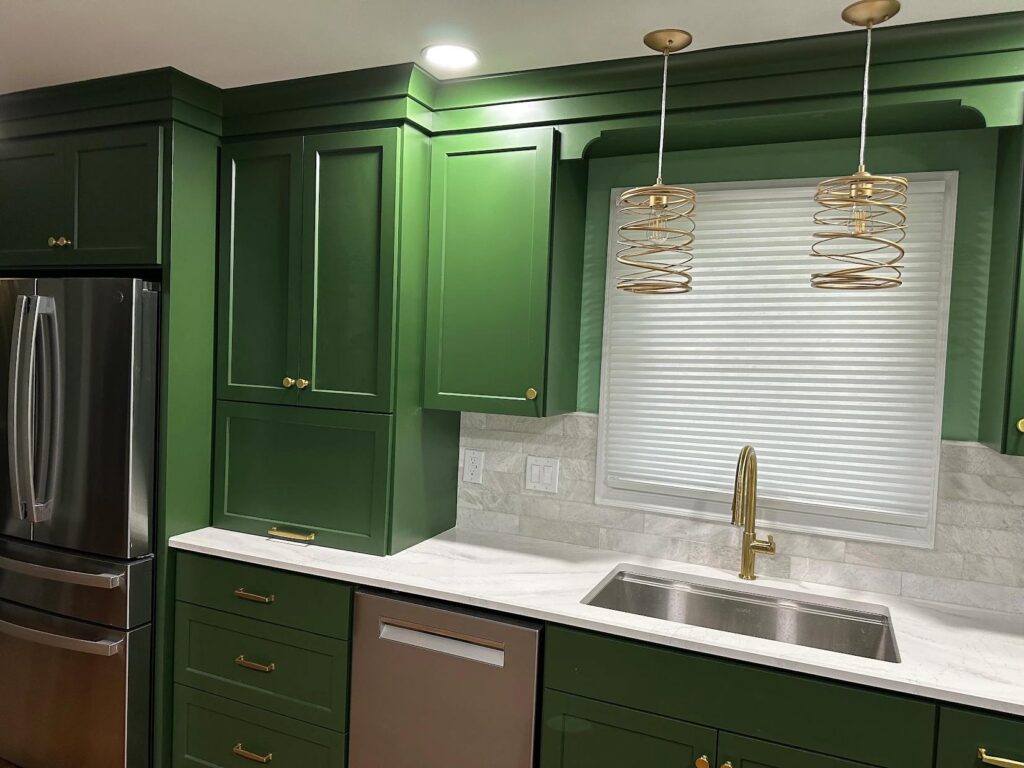 Kitchen design Lehigh Valley featuring workstation sink with integrated accessories and quartz surfaces by Laslo Custom Kitchens in Easton, PA