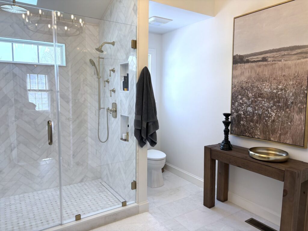 Primary bathroom remodel with custom vanity cabinets and walk in shower in Bethlehem PA