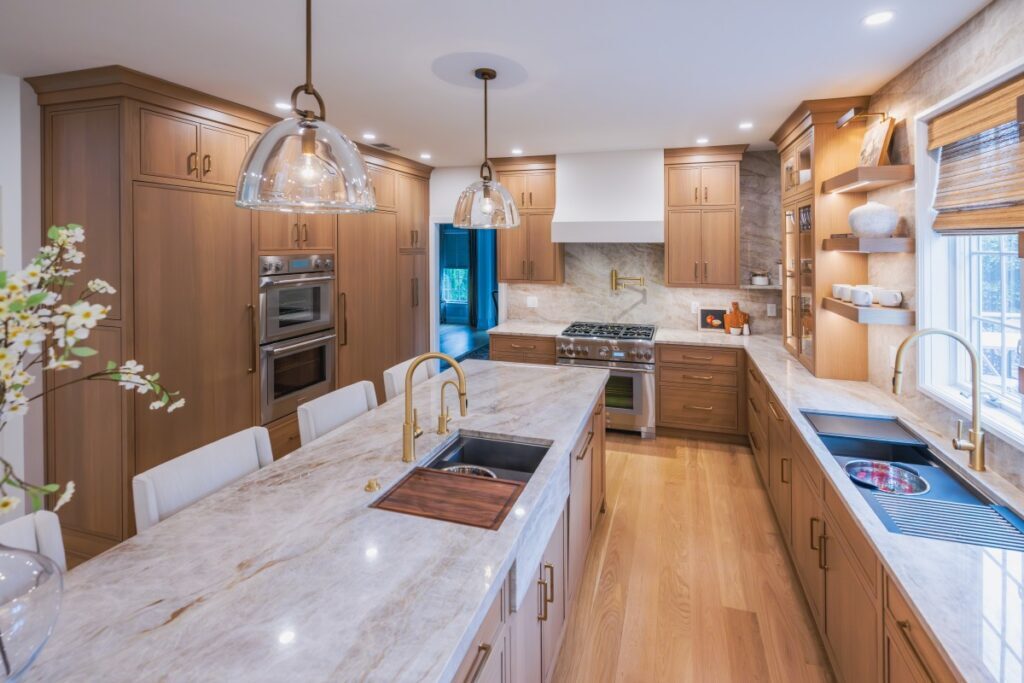 A beautifully crafted Lehigh Valley kitchen remodel showcasing a bespoke Galley workstation sink, a professional Thermador range, and elegant custom cabinetry.