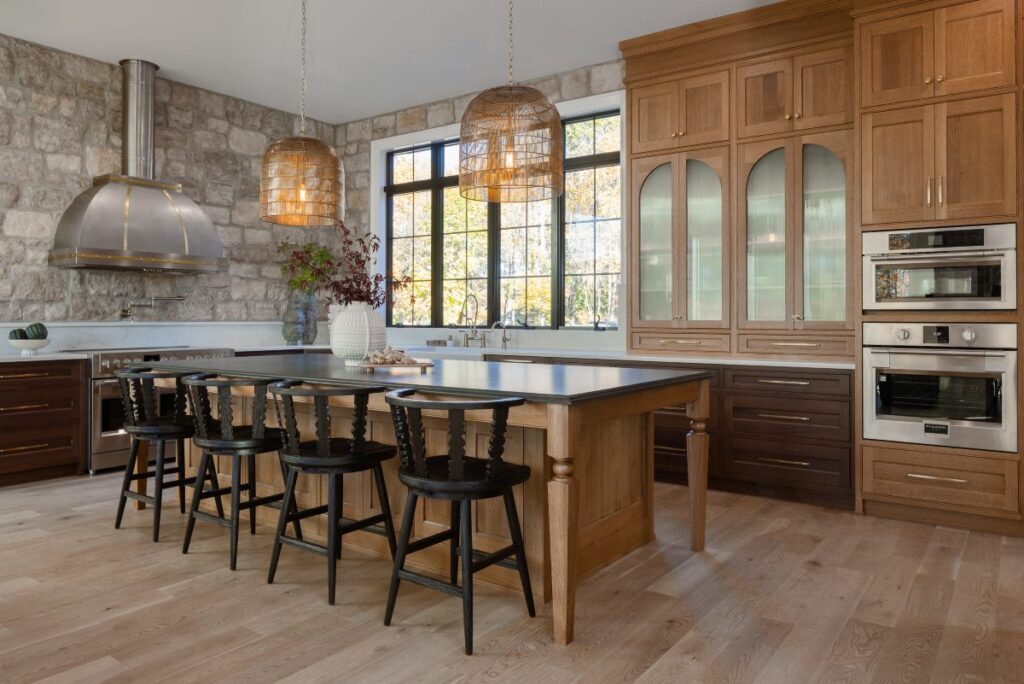 A stunning high-end space showcasing the possibilities of a 0 finance kitchen strategy, featuring an oversized kitchen island with elegant dovetail drawer boxes and premium custom cabinetry.