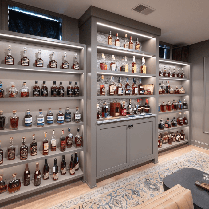 A view of the completed whiskey bar in Center Valley, PA featuring Blue Dunes granite countertops with custom millwork.