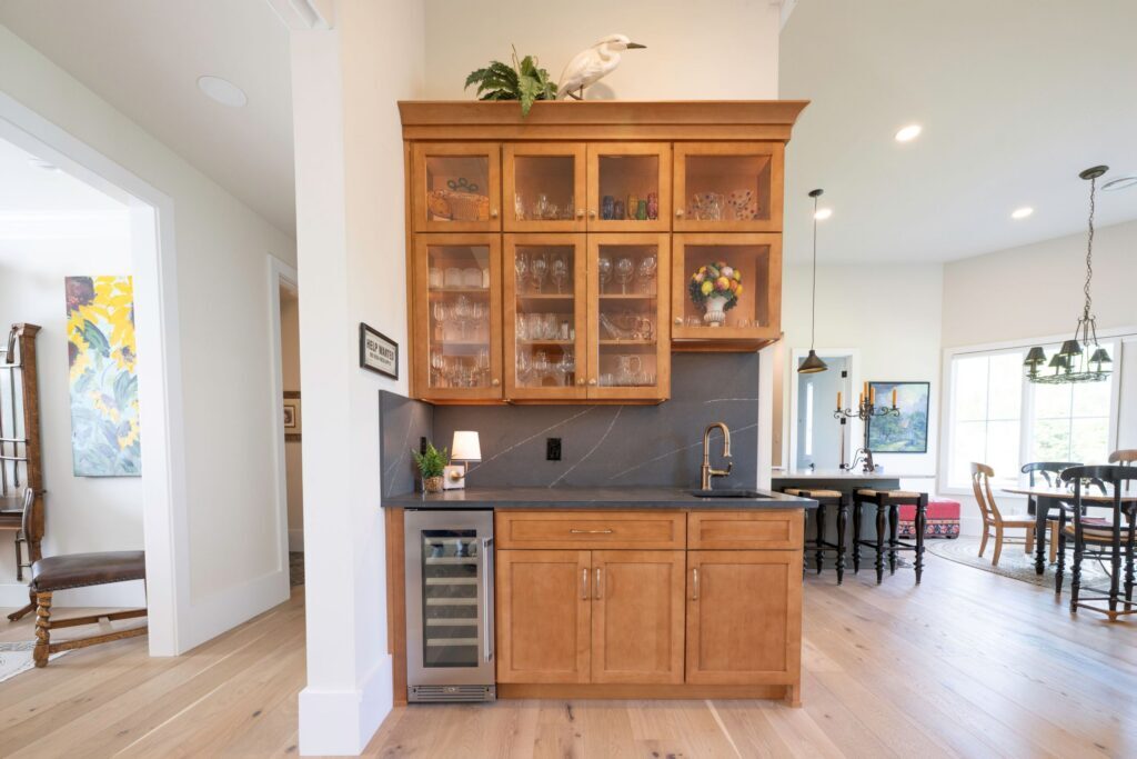A view of the completed bar cabinetry remodel in Bethlehem, PA featuring hard maple base cabinets and Metropolis Concrete quartz with custom millwork.