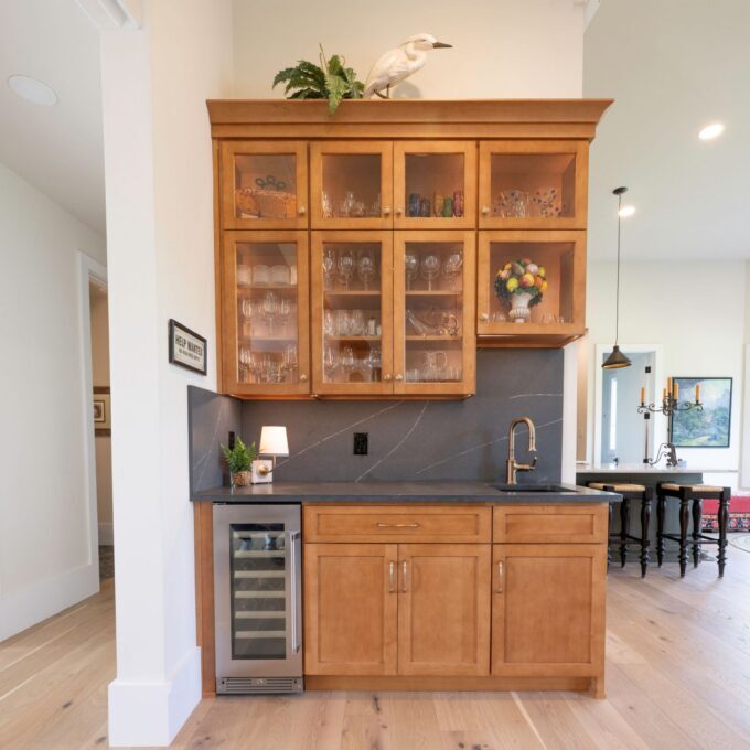 A view of the completed bar cabinetry remodel in Bethlehem, PA featuring hard maple base cabinets and Metropolis Concrete quartz with custom millwork.