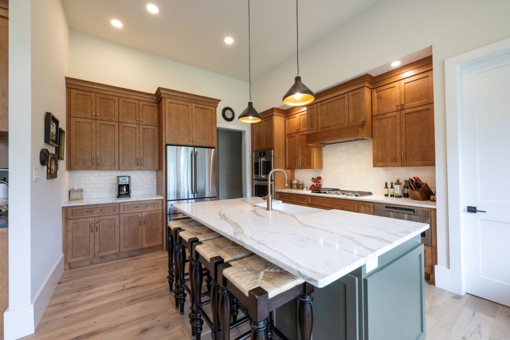 A view of the completed kitchen cabinetry remodel in Bethlehem, PA featuring Michael Angelo Gold quartz counters with custom millwork.