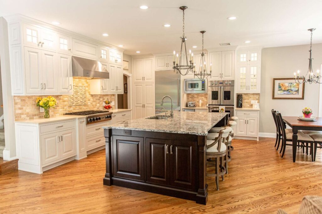 Transitional kitchen design with Classic White perimeter cabinetry, a weathered Cherry center island, and furniture-style cabinetry details.