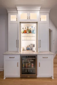 A wet bar by Laslo Custom Kitchens with a beverage cooler.